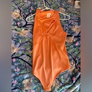 orange cutout bodysuit